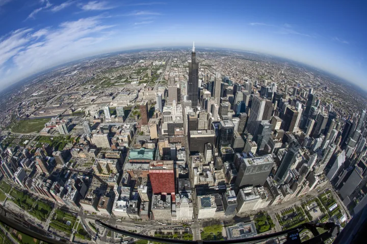 Aerial fisheye drone panorama of downtown Chicago, showcasing 180° field of view and barrel distortion for wide-area monitoring